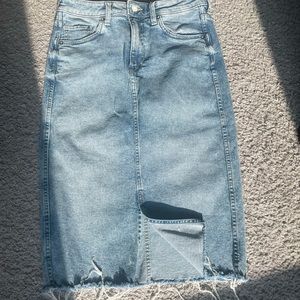 H&M Denim mid- skirt with distressed edges with mini split in the middle front